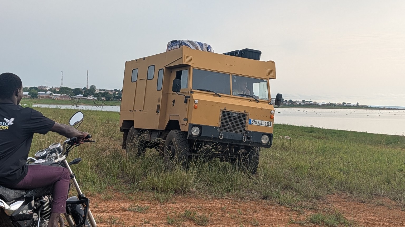 A camper vehicle parked at Dream Village’s riverside camping area